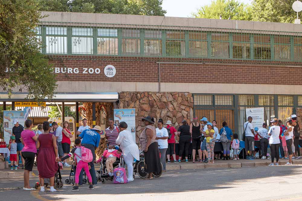 Participants and organisers at the registration desk for the Nappy Run at Johannesburg Zoo
